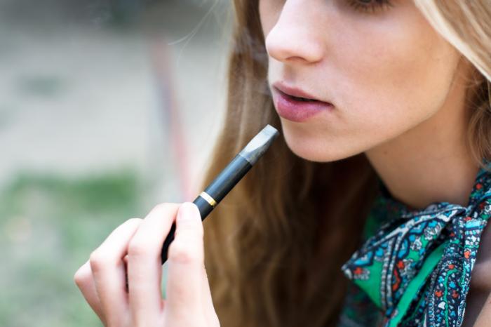 A girl using an e-cigarette