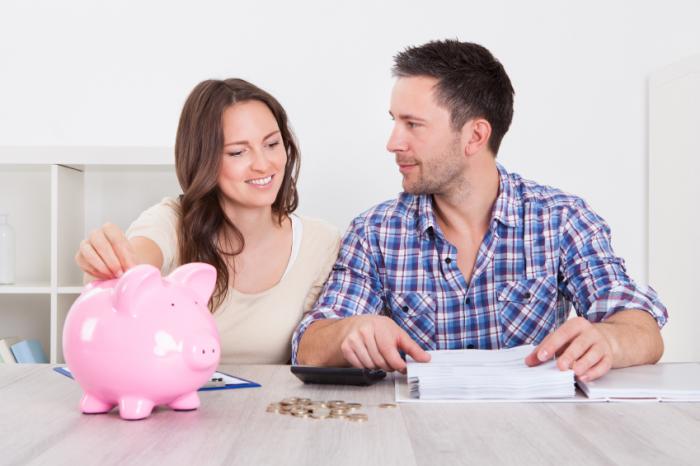 married couple with piggy bank