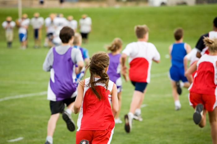 children running on sports field