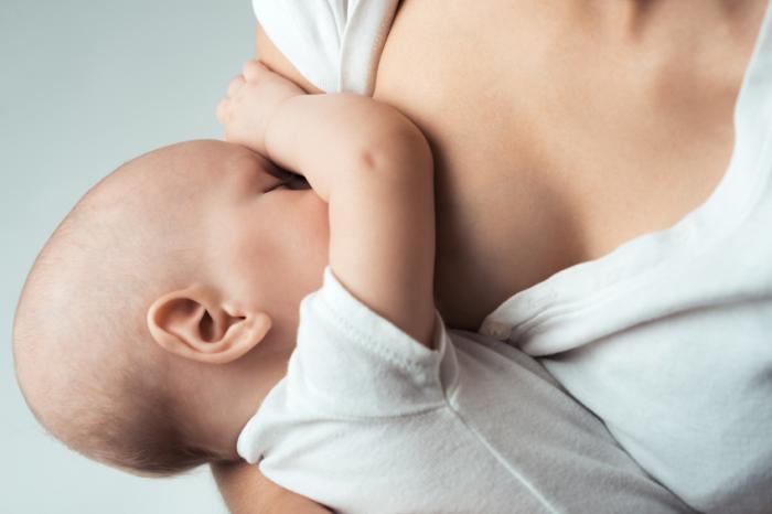 [A mother breastfeeding her baby]