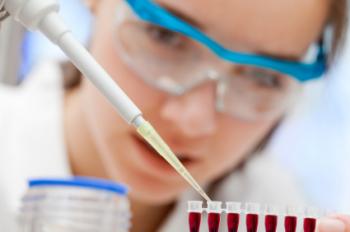 female lab worker testing blood samples