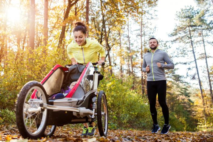 [Couple running with stroller]