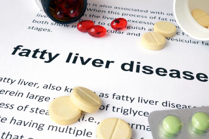 Fatty liver disease written on a page with pills.