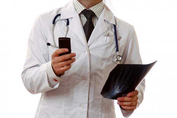bigstock-Male-doctor-on-the-phone-in-a--39352393