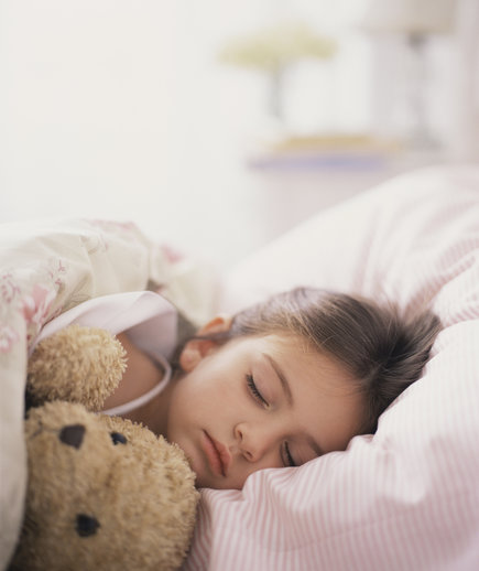 Close-up Young Girl with Teddy Bear Asleep in Bed